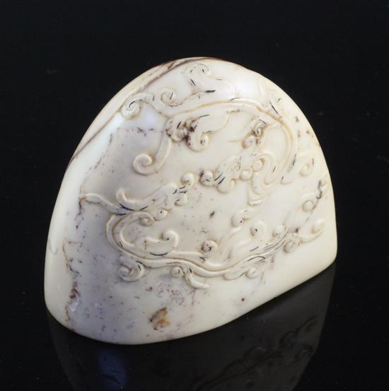 A Chinese cream and red soapstone seal, 6.3cm